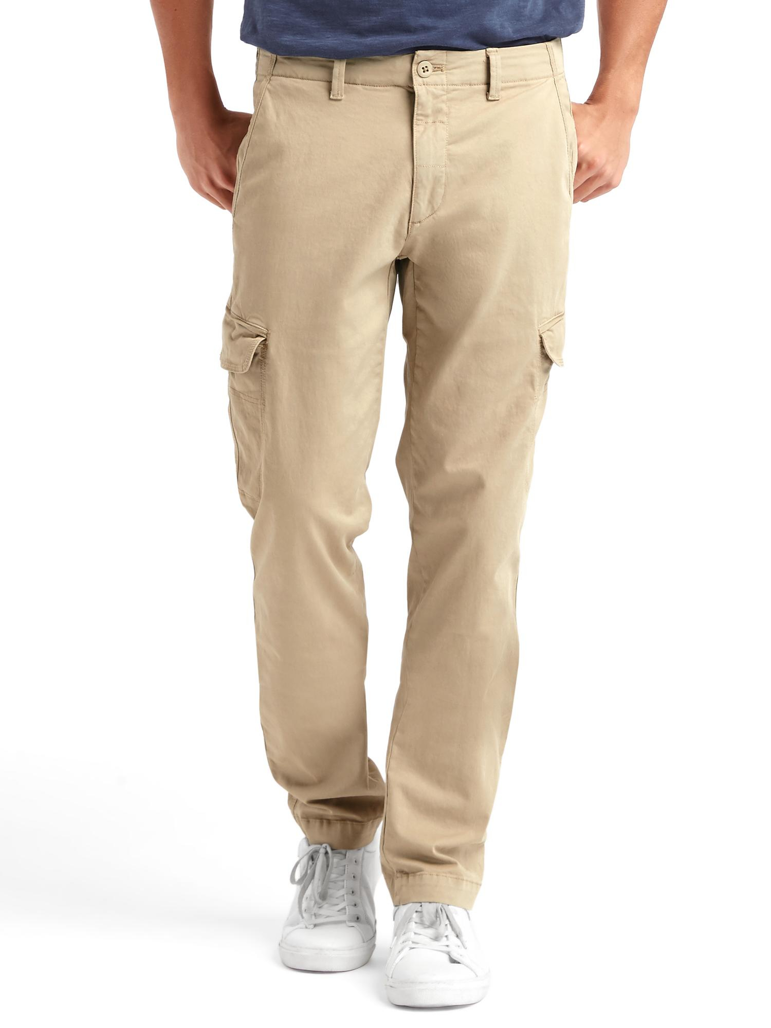 Black slim fit cargo pants A staple of any man's wardrobe, these military-inspired cargo pants are cut for a modern slim fit and made from stretch sateen for added comfort. Slim Fit: sits low at the waist. Slim through the leg. Size 32W has a 9¼